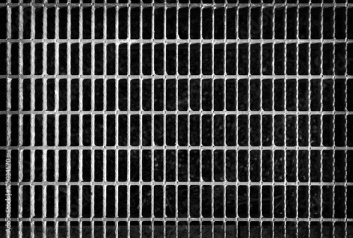 Metal grid background.Metal grill pattern texture. Black and white image.