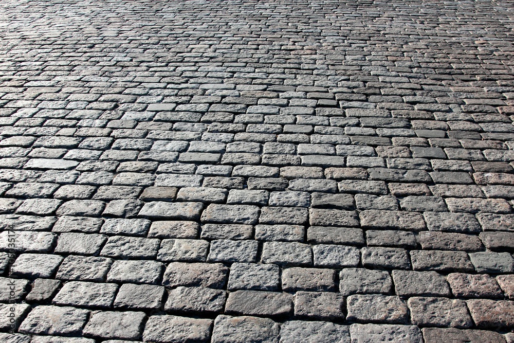pavement made of stone in sunlight and backlit conditions