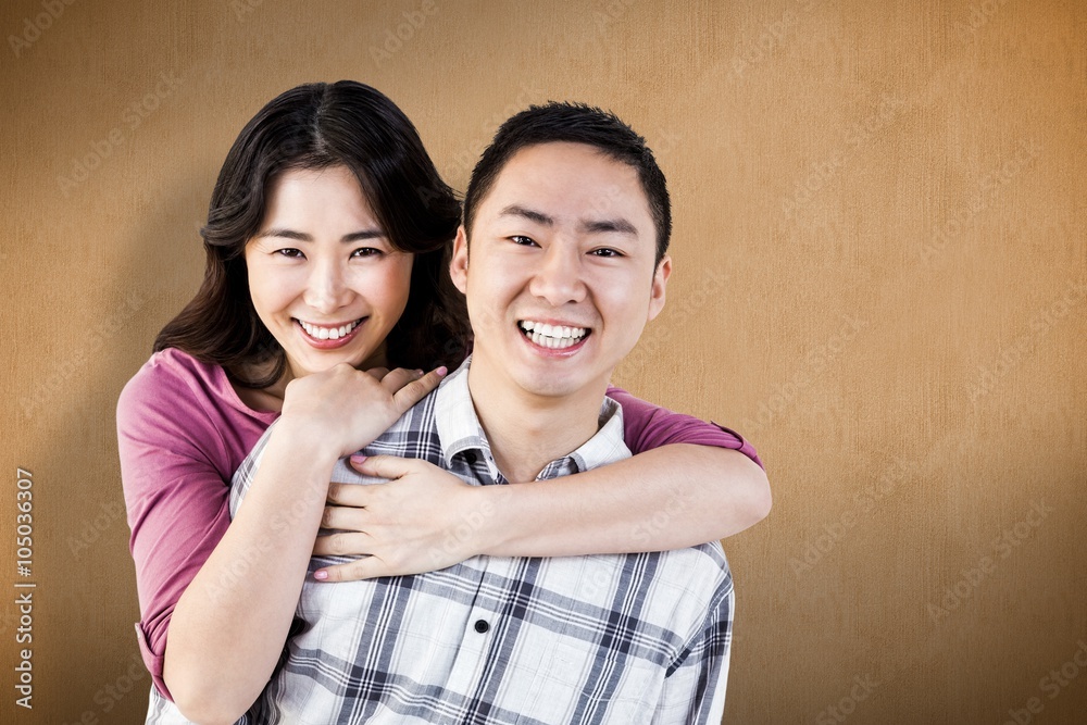 Composite image of smiling man gives girl a piggy back Composite image of smiling man gives girl a piggy back