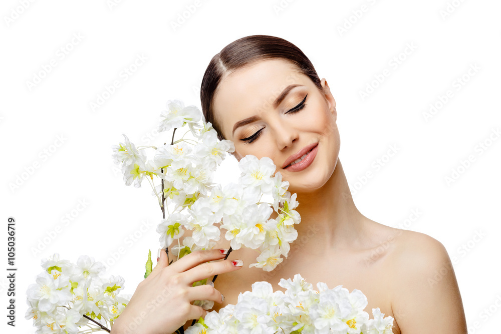 Beautiful Woman with Clean Fresh Skin holding flowering branches