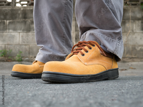 Close up of safety shoes on street
