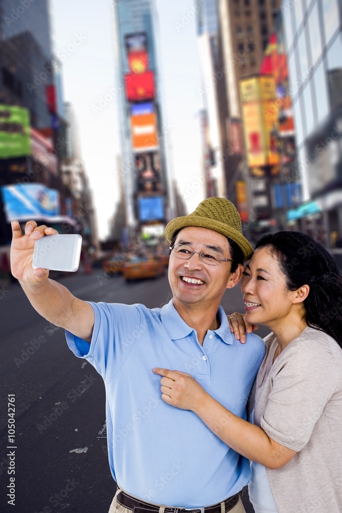 Fototapeta premium Composite image of man and woman taking a picture