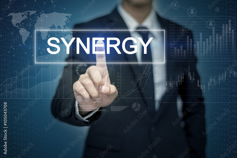 Businessman hand touching SYNERGY button on virtual screen Businessman hand touching SYNERGY button on virtual screen
