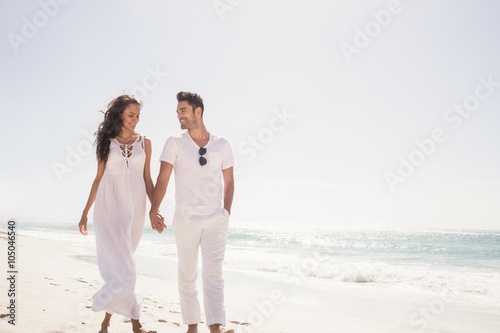 Smiling couple holding hands