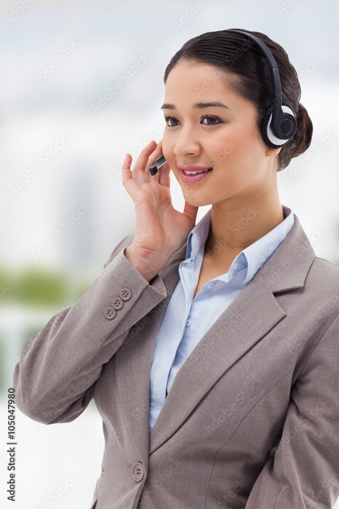 Composite image of portrait of a focused operator posing Composite image of portrait of a focused operator posing