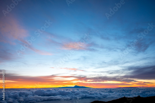 Beautiful cloudscape with Tenerife island on background on the sunrise in Spain