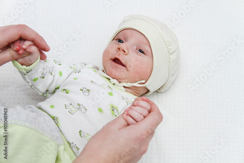 Mother playing with hertwo months  baby boy photo