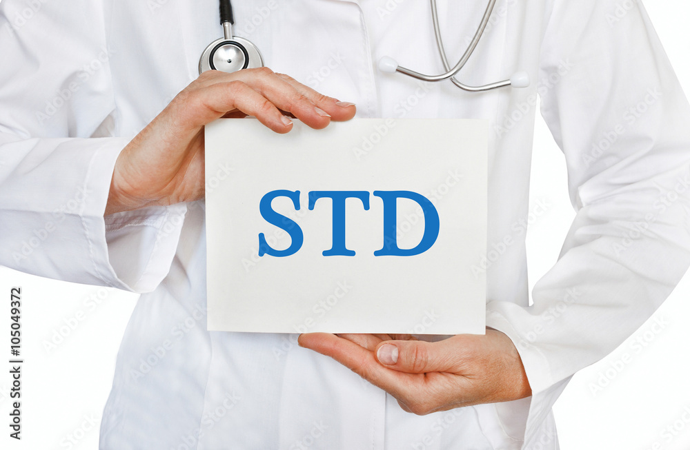 Doctor holding a card with STD, medical concept Doctor holding a card with STD, medical concept
