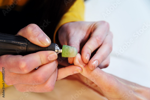 Hardware manicure in a beauty salon.