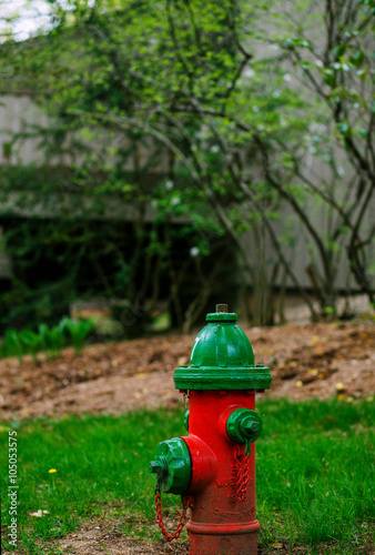 Red fire hydrant in city setting