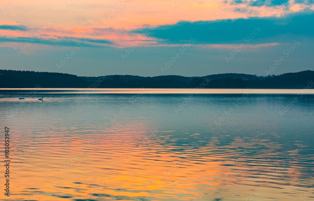 Lake landscape at colorful sunset