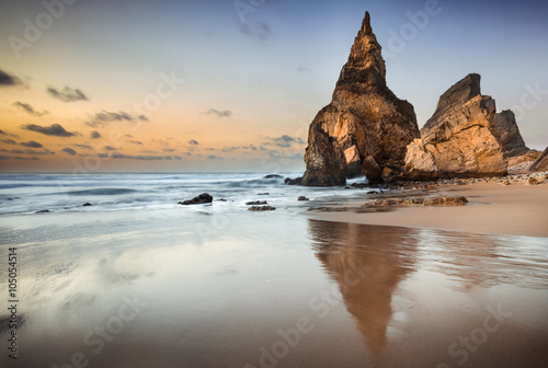Sunset at isolated and beautiful beach, rock formation