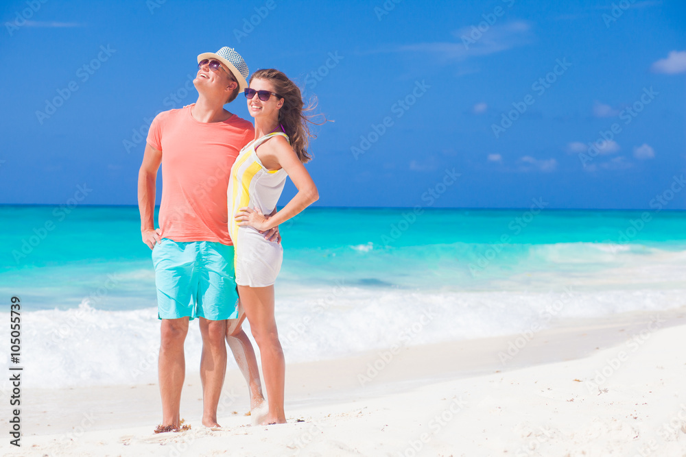 happy romantic young couple hugging at the beach happy romantic young couple hugging at the beach