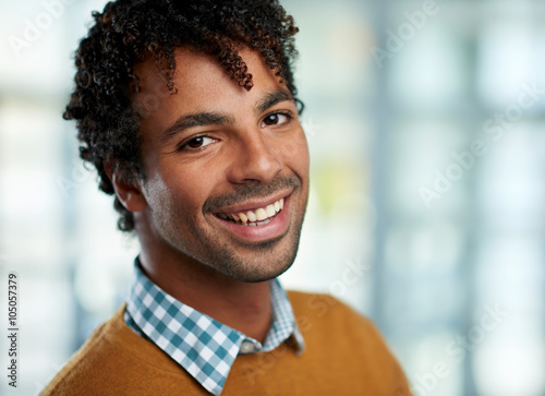 Horizontal headshot of an attractive african american businessman shot with shallow depth field.