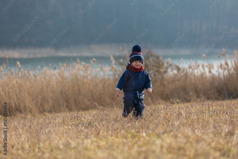 Happy caucasian child playing outdoor