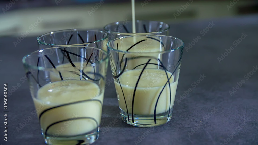 Adding more smoothie in all of the cups Adding more smoothie in all of the cups