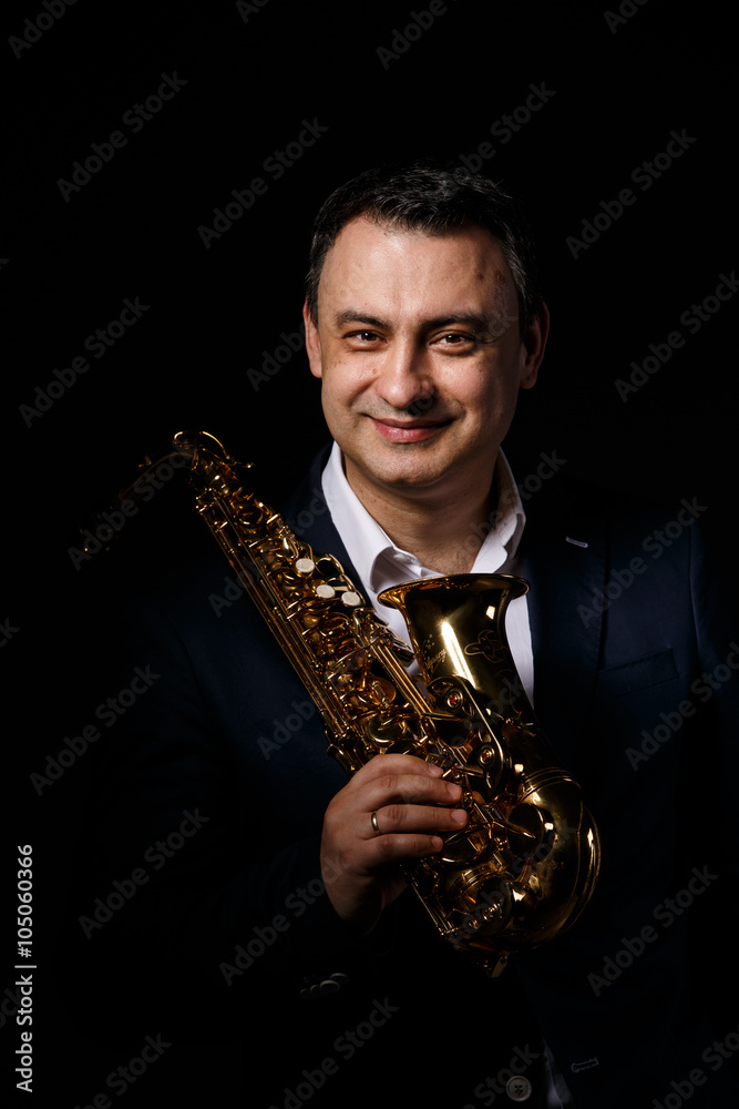 Naklejka premium musician man with saxophone. drama light.