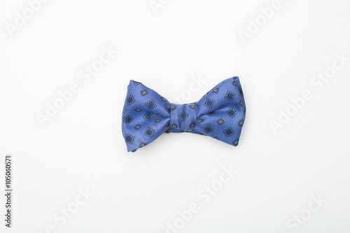 handmade blue bow-tie with colorful patterns