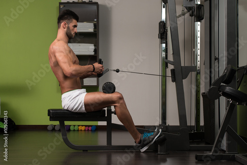 Arabic Man Doing Heavy Weight Exercise For Back