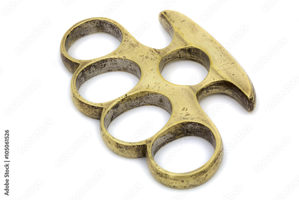 Brass knuckle-duster, weapon for hand, isolated on white backgro ...