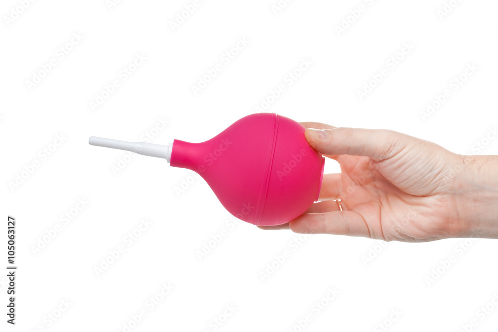 red magenta rubber bulb in hand isolated on white background
