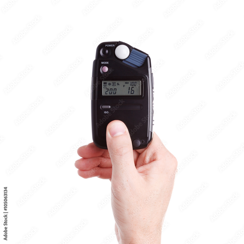 flash meter in hand on white background