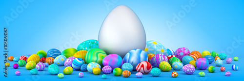 Pile of colorful Easter eggs surrounding a giant white egg