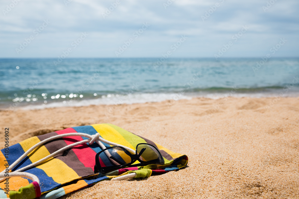 Beach accessories on the sandy shore Beach accessories on the sandy shore
