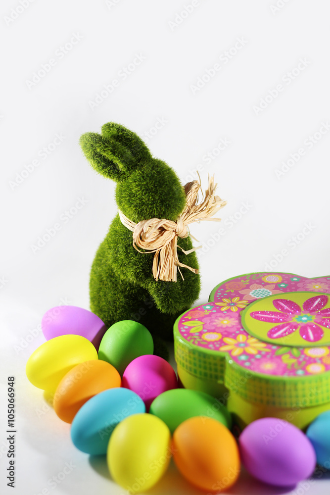 Green grass Easter bunny rabbit with colorful Easter eggs