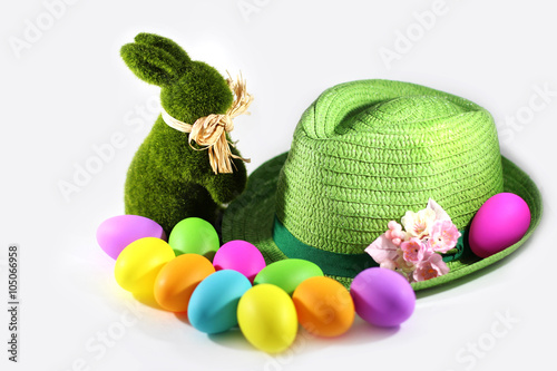 Green grass Easter bunny rabbit with colorful Easter eggs