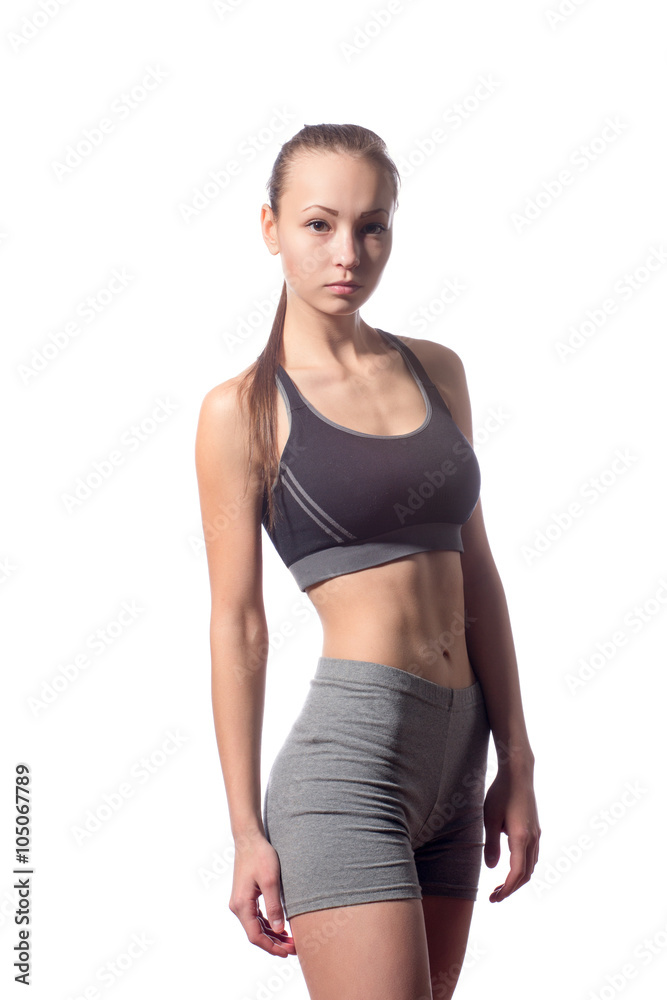 fitness woman in sport style standing against white background fitness woman in sport style standing against white background