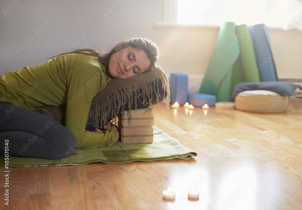 Ταπετσαρία Attractive mixed race woman doing restorative yoga