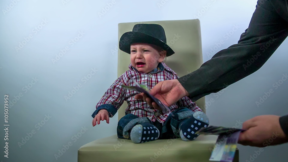 Baby refusing a pile of money Baby refusing a pile of money