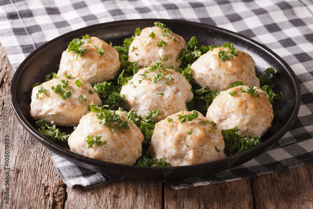 Delicious meatballs with parsley close-up on a plate. horizontal
Delicious meatballs with parsley close-up on a plate. horizontal