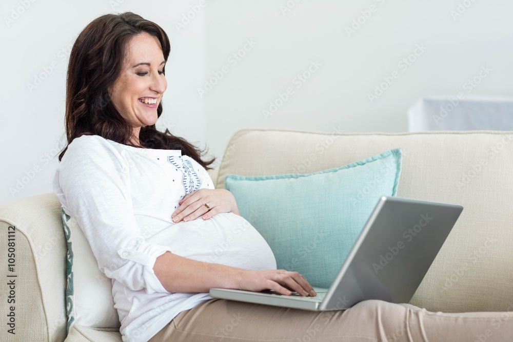 Pregnant woman resting on couch Pregnant woman resting on couch