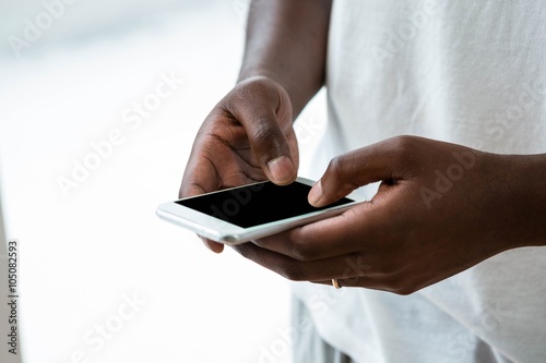 Man text messaging on mobile phone photo