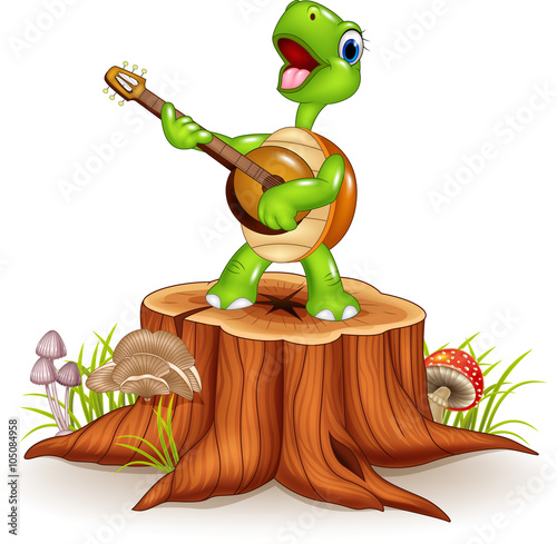 Cartoon turtle playing a guitar on tree stump photo