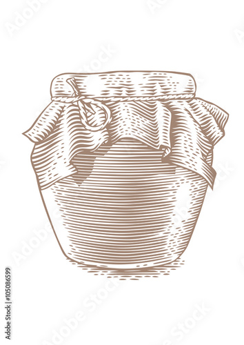 Glass jar with red jam