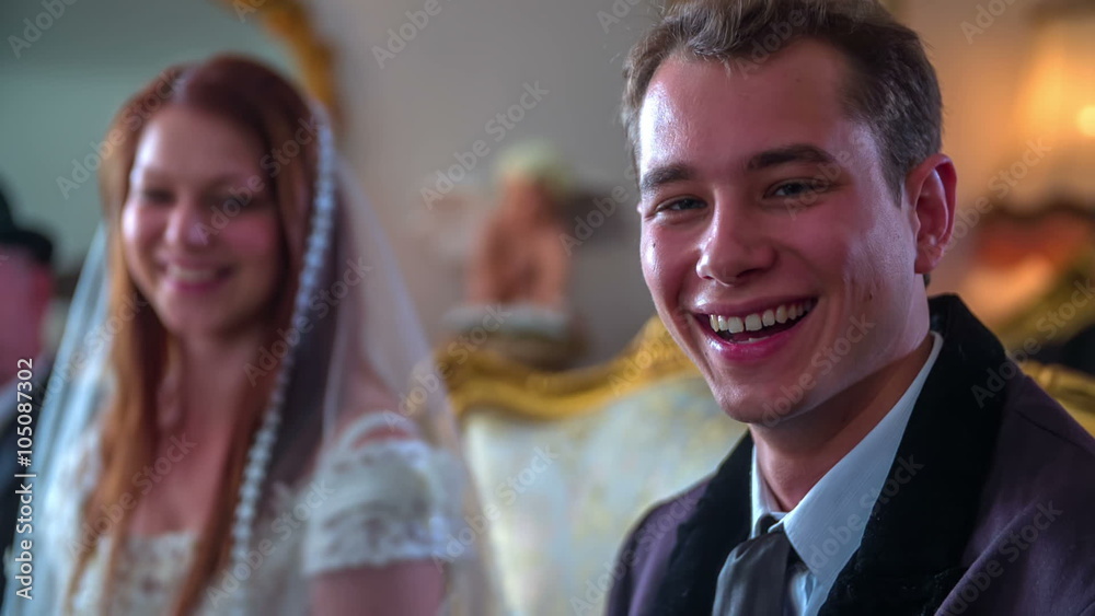 Young couple sitting down at their wedding reception Young couple sitting down at their wedding reception