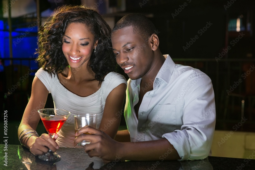 Couple having drinks at bar counter