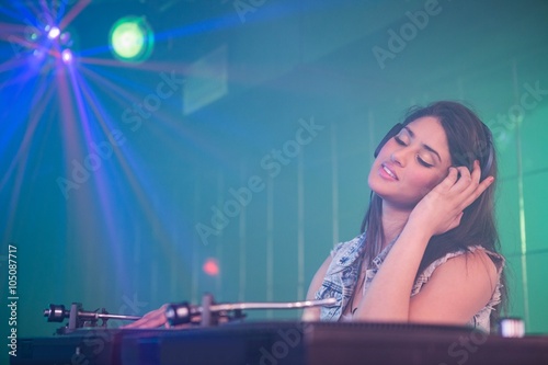 Pretty female DJ playing music © WavebreakmediaMicro