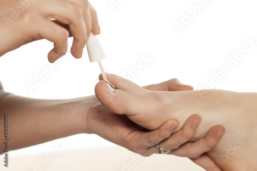 application of nail polish on feet