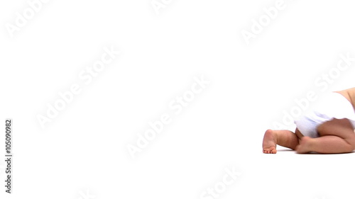 Baby crawling across white background