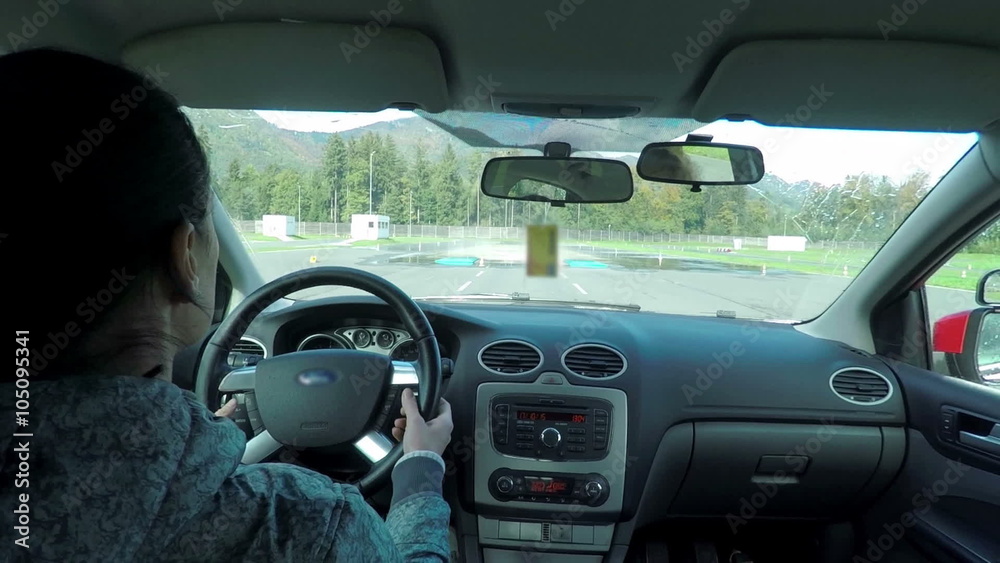 The inside of the car when two ladies are driving on a slippery track The inside of the car when two ladies are driving on a slippery track