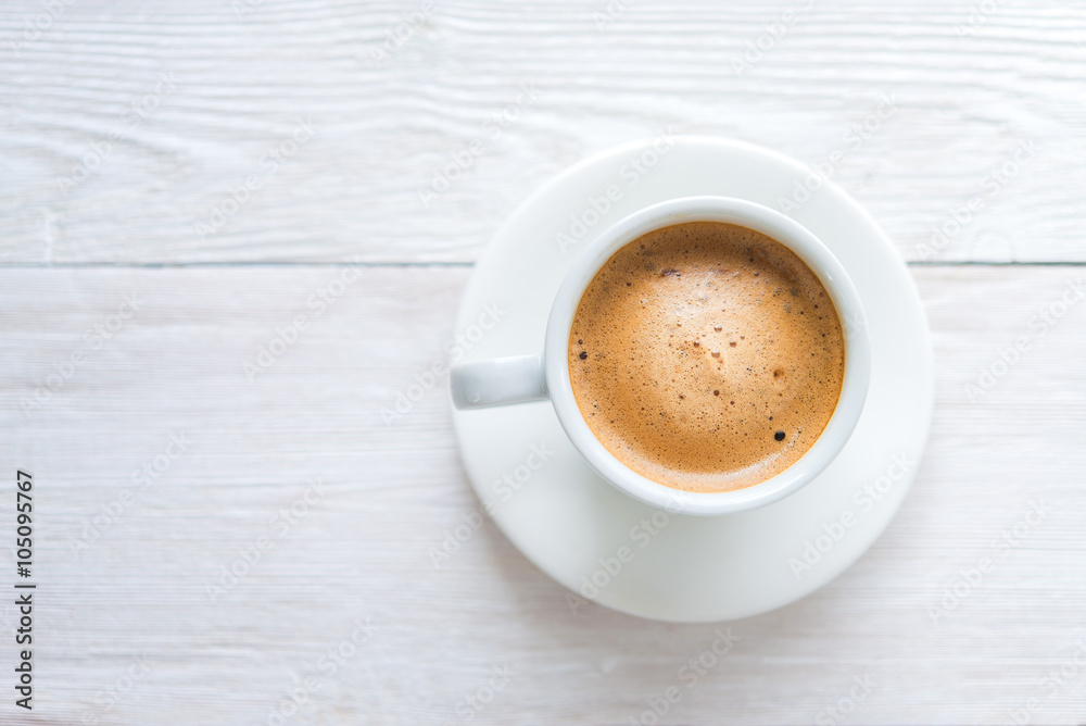 White cup of espresso coffee