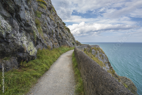 Stone rocks mountain path at Irish seacoast. Bray, Greystone