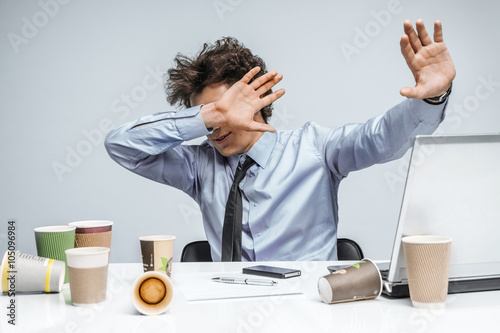 Canvas Print Shocked businessman with eyes closed is against uncensored Internet content / ov