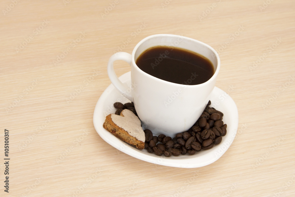 Cup of coffee with cookies on a wooden background Cup of coffee with cookies on a wooden background