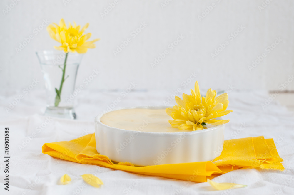 Portion cheesecake on white and yellow background