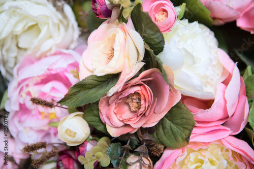 wedding bouquet with rose bush  Ranunculus asiaticus as a background  